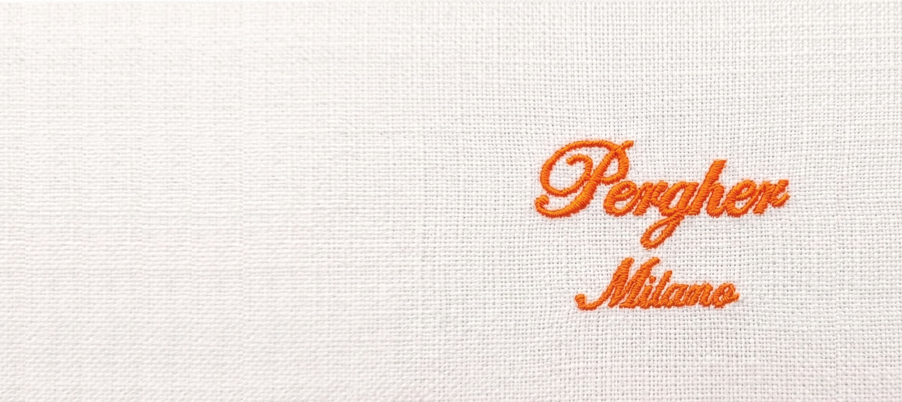 Logo Pergher Milano ricamato a mano sulla pelle